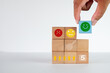 © Pakorn - Hand choosing blue wooden cube with green smile face concept for Customer Satisfaction Five-Star Rating,Customer Feedback,Quality Assurance, Client Feedback, Premium Experience, Review System.