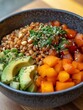 © DZIKRA  - A colorful bowl filled with grains, fruits, and vegetables, showcasing a healthy meal.
