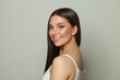 © artmim - Smiling brunette woman with glowing skin, subtle makeup and a gentle smile. Young model posing, portrait