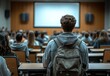 © Diki prayoga - Student Sits In Lecture Hall Facing Presentation