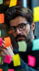 Wall Mural - Man organizing colorful sticky notes. AI.