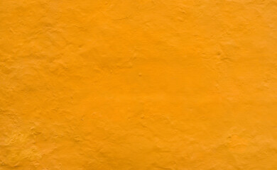 Wall Mural - yellow stucco wall background texture