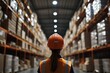 © Odin AI - Warehouse worker inspecting stock in a storage facility during daytime hours in an organized environment