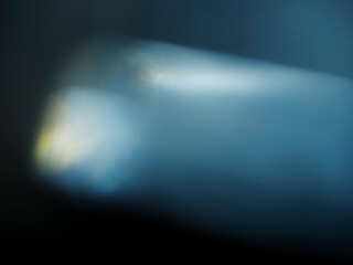 Wall Mural - colorful light leak on dark background. cinematic visual lens effect for design and creative ideas. 