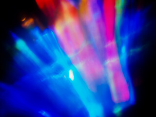 Wall Mural - a colorful, blurry background with a rainbow of colors. the colors are bright and vibrant, creating 