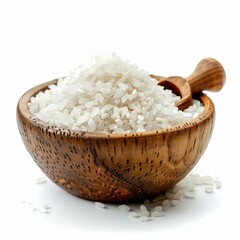 Wooden bowl is overflowing with raw white rice and small scoop on white background