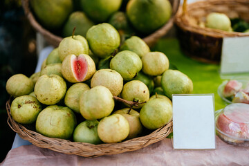 Wall Mural - In Asia, consumers are increasingly looking for organic fruits like guava in local markets as they realize the long-term health benefits of eating food grown without the use of harmful chemicals.