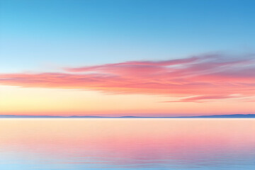 Wall Mural - Serene pink and blue sunrise over calm water.