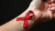 © Galeno - aids red ribbon hangs wrist elegance simplicity awareness serious global health issue every day