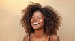 © jiawei - Africa American woman with curly hair is smiling in studio background