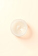 © Go - Pure transparent cosmetic gel on beige background, top view, minimalism, with white tones