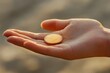 © Hafiz - Recovery sobriety chip in outstretched palm, soft directional lighting, emotional detail, with copy space