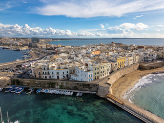 Wall Mural - Aerial drone view of the coastal town named Gallipoli at the mediterranean sea in Italy.