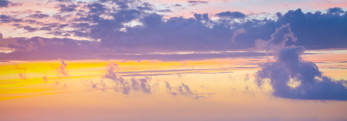 Wall Mural - Orange and purple sky over at sunset