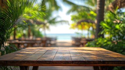 Wall Mural - empty wooden bar table with a blurred beach scene and coconut leaf framing for product display