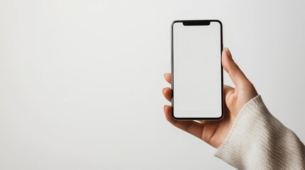 Hand holding smartphone with blank screen on white background