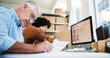 © peopleimages.com - Senior man, writing and documents for distribution industry, inventory update and logistics information. People, computer and ecommerce paperwork with stock checklist, startup admin and order report