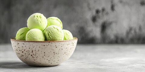 Refreshing Minty Green Ice Cream Served in a Beautifully Speckled Bowl for Enjoyment