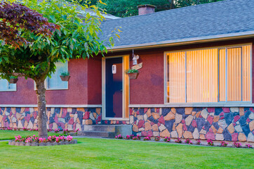 Wall Mural - Entrance of luxury house with nice green Summer landscape at night in Vancouver, Canada, North America. June 2024.