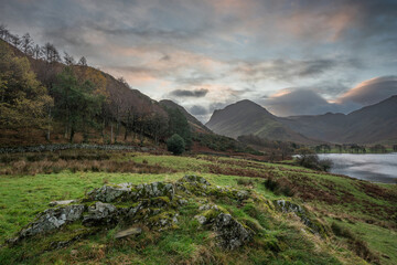 Wall Mural - Beautiful Autumn sunrise landscape image of Buttermere in Lake District with Fleetwith Pike and Haystacks mountains