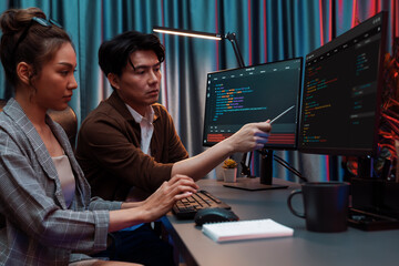 Wall Mural - it developers discussing with point to intelligent website development coder system running data onl