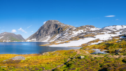Wall Mural - norway. mountain landscape. view of a high mountain in a valley. huge sharp rocks and reflection on 