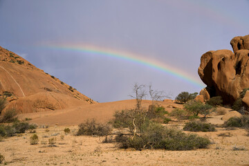a single rainbow over the rocks at bushman paradise, spitzkoppe, namibia