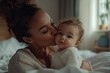 © Javid - Mother kissing her baby on a bed, close-up portrait. AI generated image