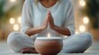 © olegganko - Meditation session with soothing candlelight in a serene indoor setting