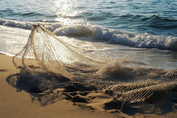 Wall Mural - Net on sandy beach, ocean waves nearby.