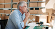 © peopleimages.com - Ideas, logistics and mature businessman in office with cardboard boxes for shipping plan. Decision, thinking and male supply chain manager with admin for package, order or parcel distribution.