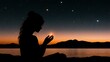 © Helois - Silhouette of woman holding small light source at sunset, starry night sky and lake.