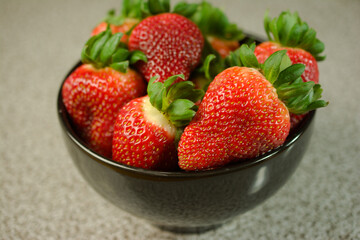 Wall Mural - Juicy Strawberries in a Ceramic Bowl