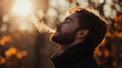 © mahamad - Attractive man breathing in outdoor air.
