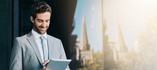 Wall Mural - Planning, smile and tablet with business man at window of office in Amsterdam for online research. App, banner and city with happy corporate employee on mockup space in Netherlands for strategy