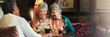 © peopleimages.com - Elderly people, friends and happy in home for dinner, reunion or gossip story in banner. Senior women, laugh and chatting with food for bonding, storytelling or birthday meal with wine in living room