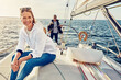 © peopleimages.com - Ocean, couple and happy woman on yacht for view, vacation or holiday with summer adventure in Greece. Smile, thinking and female tourist on boat at sea to relax for tropical weekend trip or travel
