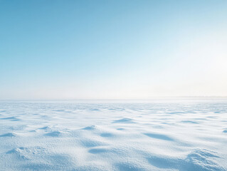 Endless expanse of snow under a clear blue sky in a winter landscape