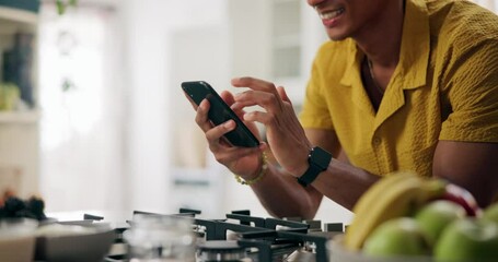 Kitchen, hands and man with happiness on smartphone for social media, text notification and post at home. Male person, apartment and smile for message on dating app for communication and networking