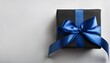 © Eli - Black Gift Box with Dark Blue Ribbon on White Background. Top View of Father Day Gifts with Copy Space
