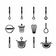 © Irinka Dimkovna - A set of black and white kitchen utensils on white background. The utensile set includes a slotted spoon, fork, ladle, serving spoon, two strainers, whisk, slotted turner, tea infuser, and colander.