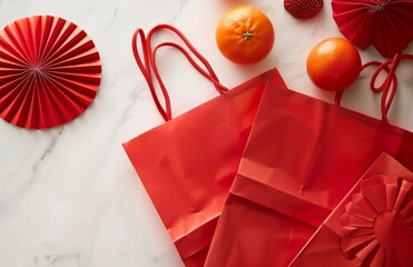 Red gift bags oranges, Chinese fans on white marble table. Lunar New Year decorations. Minimalist design. Celebration, prosperity concept for 2025 holiday season. Beautiful art pieces for festive 