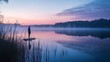 © zzz - Serene Silhouette A Lone Figure Contemplating at the Edge of a Misty Lake During a Tranquil Sunrise