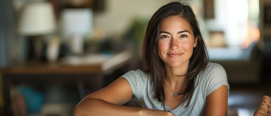 Wall Mural - woman sitting inside a house looking at the camera