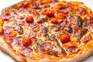 Wall Mural - Homemade freshly baked pepperoni pizza on a white background. Close-up, chosen focus.