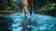 © Ibnu - Woman Running Through Water Splashing Legs