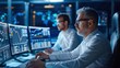 © Vilaysack - Two professionals analyze data on multiple screens in a high-tech environment, focused on financial charts and market trends.