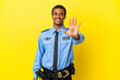 © luismolinero - African American police man over isolated yellow background counting five with fingers