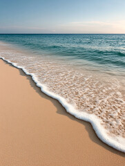 Wall Mural - Tranquil beach with gentle waves at sunset