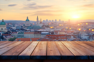 Wall Mural - Wooden table overlooking a city sunrise.